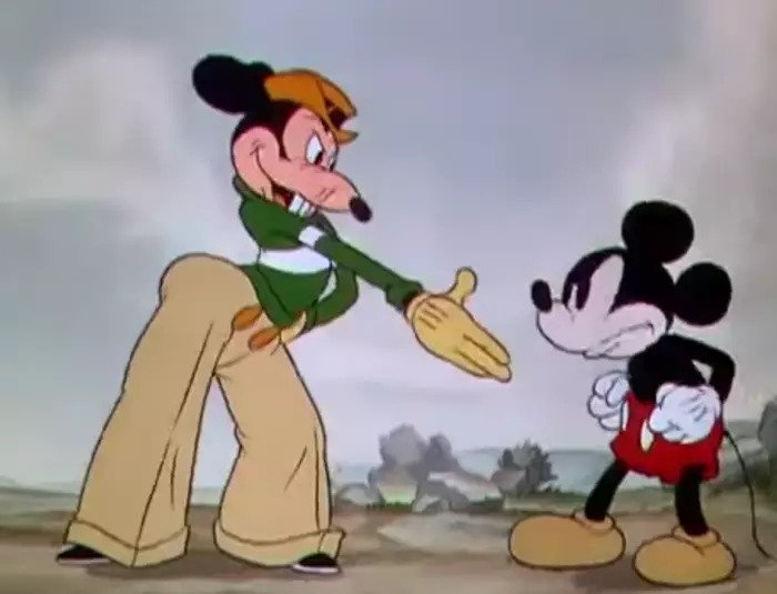 Mortimer trying to Shake hands with n angry Mickey.